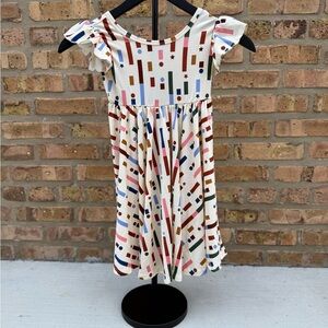 Dot Dot Smile Cream Dress with Colorful Geometric Pattern